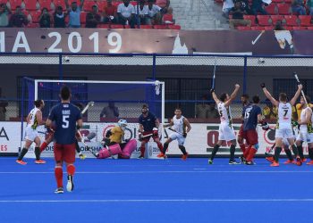 South African players (in white) celebrate after their winning goal against USA at the Kalinga Stadium