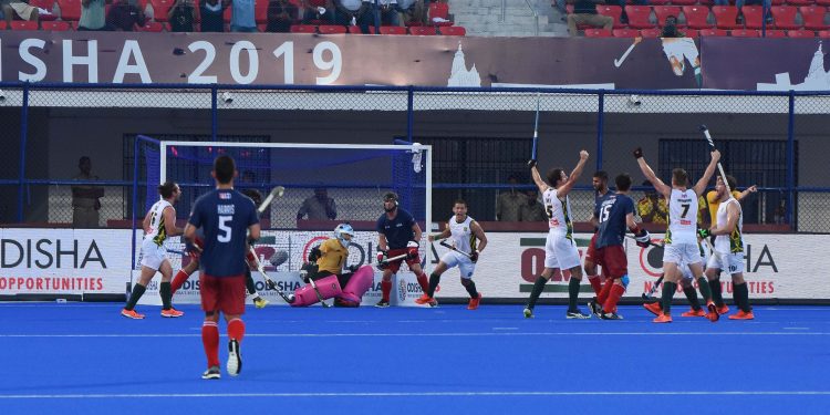 South African players (in white) celebrate after their winning goal against USA at the Kalinga Stadium