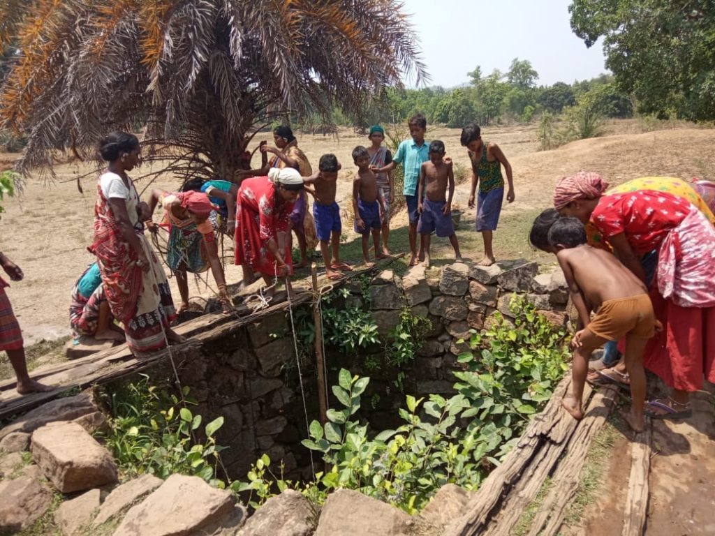 Tribals drink muddy water from open well