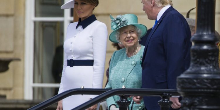 First lady Melania Trump, left, stands as Queen Elizabeth II smiles while talking with President Donald Trump at Buckingham Palace, Monday, June 3, 2019, in London. (AP Photo/Alex Brandon)