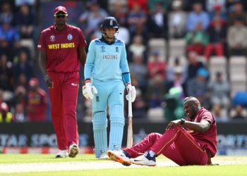 SOUTHAMPTON, ENGLAND - JUNE 14: Andre Russell of West Indies lies on the wicket after injuring himself bowling during the Group Stage match of the ICC Cricket World Cup 2019 between England and West Indies at The Ageas Bowl on June 14, 2019 in Southampton, England. (Photo by Michael Steele/Getty Images)