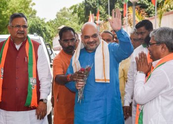 Union Home Minister and BJP president Amit Shah waves as he arrives for a meeting of BJP national office-bearers and state-heads, in New Delhi, Thursday
