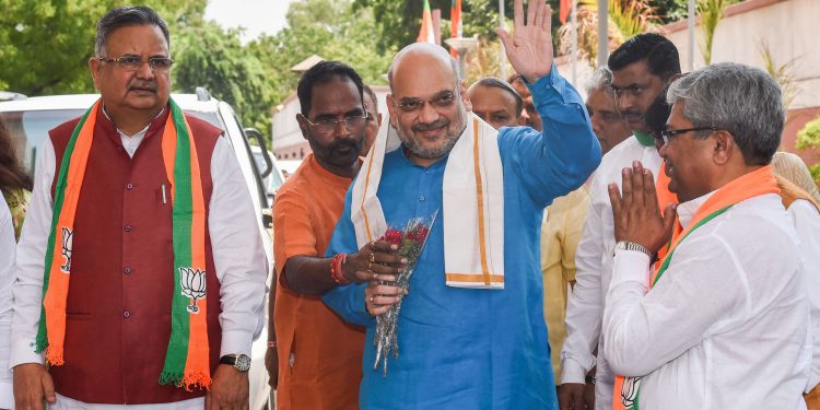 Union Home Minister and BJP president Amit Shah waves as he arrives for a meeting of BJP national office-bearers and state-heads, in New Delhi, Thursday