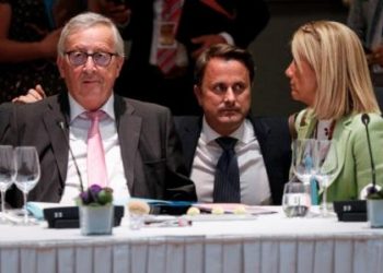 Luxembourgs Prime Minister Xavier Bettel (C), speaks with European Commission President Jean-Claude Juncker (L), during a round table meeting at an EU summit in Brussels, Sunday. AP/PTI