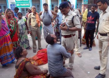 Relatives of the victims of a mob lynching incident mourn outside a hospital in Chapra in Bihar, Friday