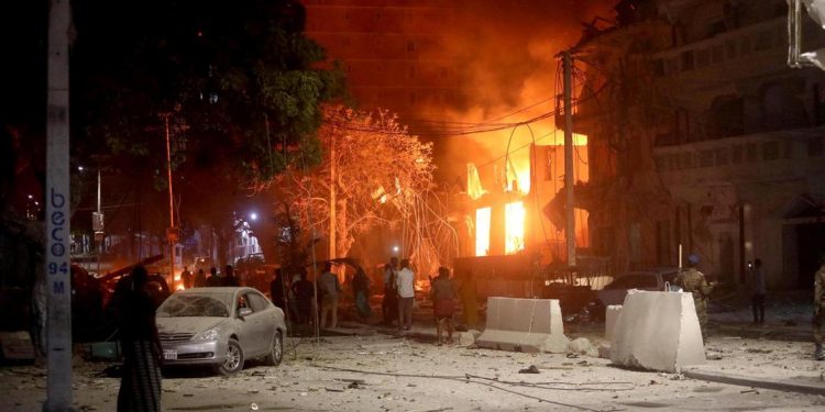 A suicide bomber rammed a vehicle loaded with explosives into the Medina hotel in the port town of Kismayo Friday before several heavily armed gunmen forced their way inside, shooting as they went, authorities said.