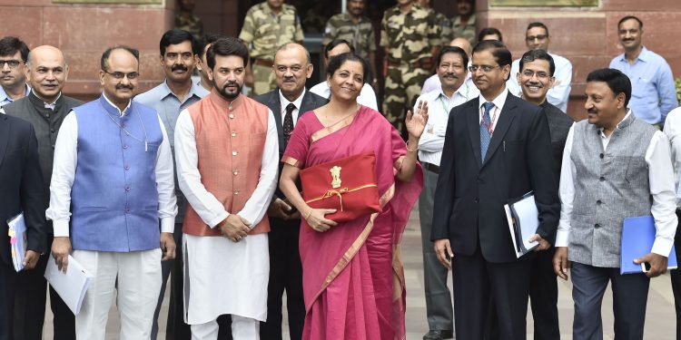 Nirmala Sitharaman holds on to the budget papers wrapped in red cloth . File Image