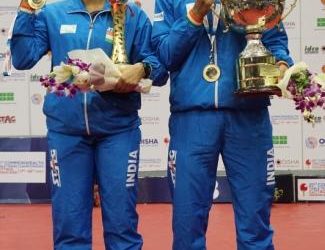 Ayhika Mukherjee and Harmeet Desai pose with the trophies in Cuttack Monday. OP Photo