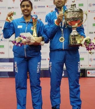 Ayhika Mukherjee and Harmeet Desai pose with the trophies in Cuttack Monday. OP Photo