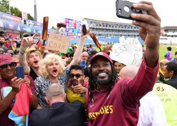 Chris Gayle takes a selfie with fans after the game Thursday