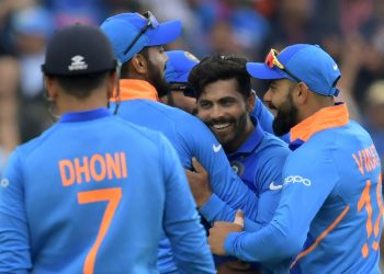 Teammates celebrate with Ravindra Jadeja after the dismissal of Henry Nicholls