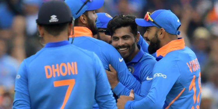 Teammates celebrate with Ravindra Jadeja after the dismissal of Henry Nicholls