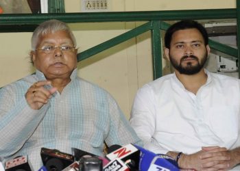 Lalu Prasad Yadav (L) and son Tejashwi. File pic