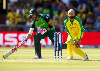 Nathan Lyon (in yellow) in the game against South Africa