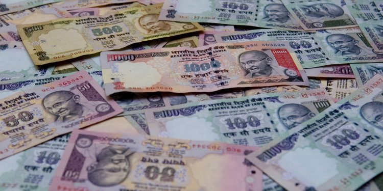 Rupee slips 14 paise to 71.11 against USD in early trade