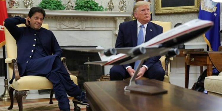 U.S. President Donald Trump and Pakistan’s Prime Minister Khan listen to reporters questions while meeting in the Oval Office at the White House in Washington, U.S., July 22, 2019. REUTERS/Jonathan Ernst