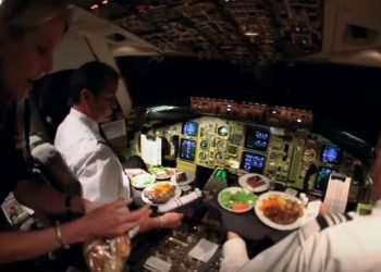 Why are pilots and co-pilots served different food in airplane?