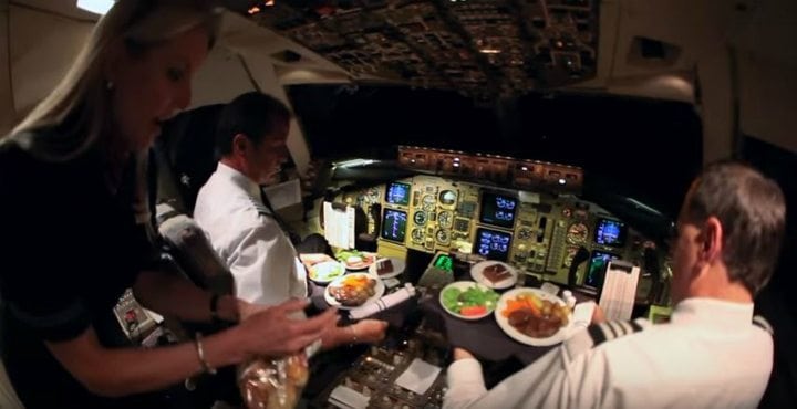 Why are pilots and co-pilots served different food in airplane?