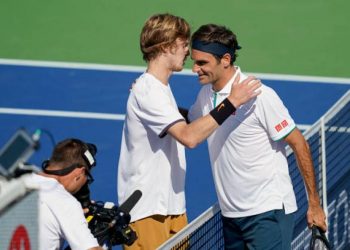 Roger Federer congratulates Andrey Rublev after the match Thursday