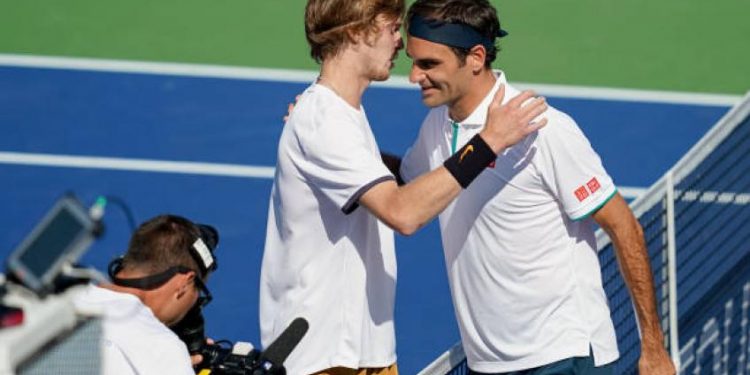 Roger Federer congratulates Andrey Rublev after the match Thursday