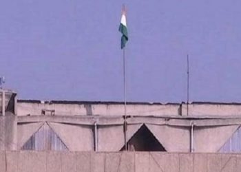 The Indian Tricolour atop the Civil Secretariat building in Srinagar. The empty pole is the one where the J&K flag used to fly