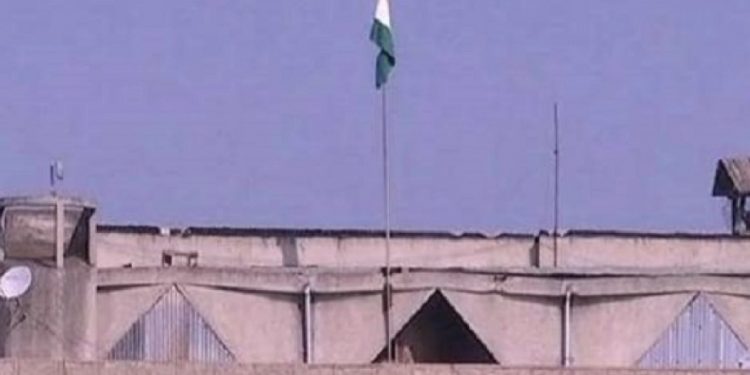 The Indian Tricolour atop the Civil Secretariat building in Srinagar. The empty pole is the one where the J&K flag used to fly
