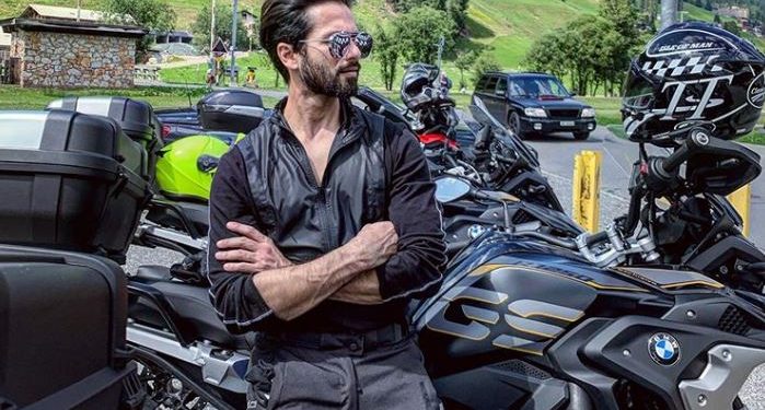 The ‘Kabir Singh’ star shared a photograph of himself, leaning on his bike and with a picturesque countryside backdrop.