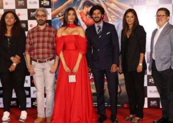 Sonam Kapoor (in red) with Dulquer Salmaan to her left