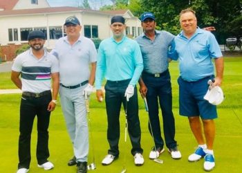 Sporting his new bandana look Dhoni was seen flaunting his salt and pepper look with a club in hand alongside Jadhav on the latter's Instagram post.