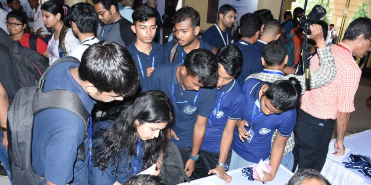 Students at the registration desk, Saturday