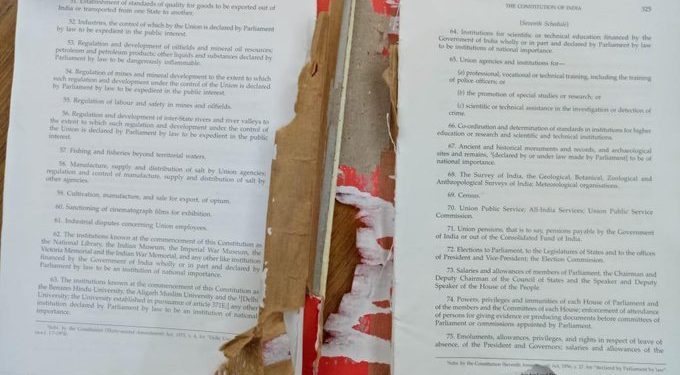 The torn up copy of the Indian Constitution.