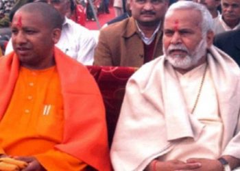 Swami Chinmayanand (R) with UP Chief Minister Yogi Adityanath. File pic