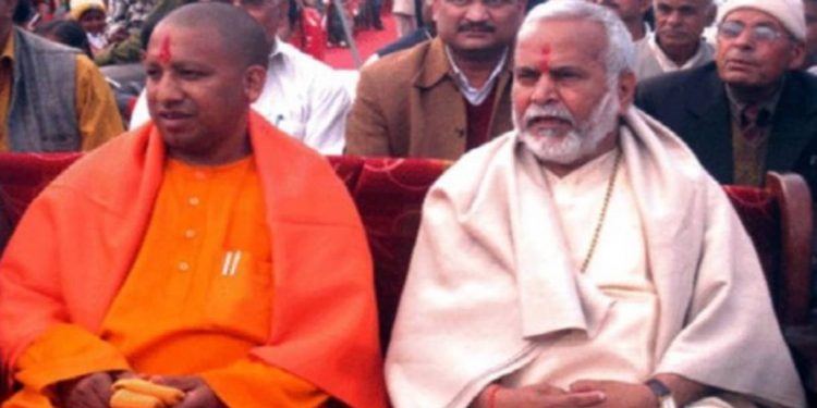 Swami Chinmayanand (R) with UP Chief Minister Yogi Adityanath. File pic