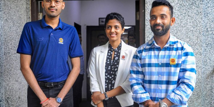 Ajinkya Rahane (R) with other IOC employed sportspersons at a press conference Thursday