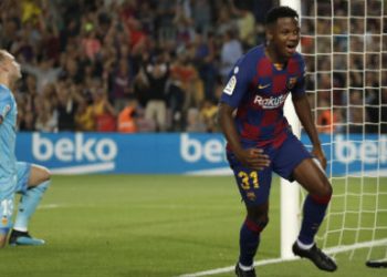 Barcelona's Ansu Fati, right, celebrates after scoring the opening goal as Valencia's goalkeeper Jasper Cillessen reacts during the Spanish La Liga soccer match between FC Barcelona and Valencia CF (AP)