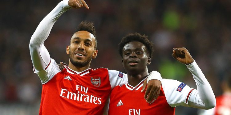 Two of the goal scorers for Arsenal Pierre-Emerick Aubameyang (L) and Bukayo Saka