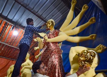 Finish touches being given to an idol of Goddess Durga