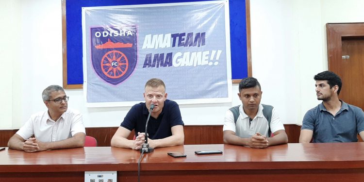 Odisha FC coach Joseph Gambau (2nd L) addresses the media at the Kalinga Stadium, Tuesday. Other officials of the ISL franchise can also be seen in the picture