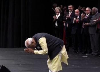 Prime Minister Narendra Modi greets his supporters as he arrives for the mega Howdy, Modi gala event in Houston, Sunday. PTI Photo