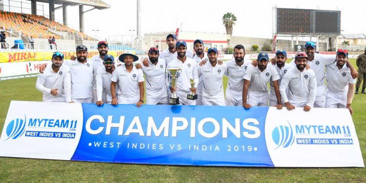 The Indian team pose for a group photo after winning the series against the West Indies