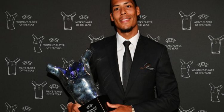 Virgil van Dijk with the UEFA Best Men's Player trophy