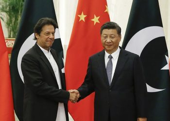 China's President Xi Jinping, right, meets Pakistan's Prime Minister Imran Khan at the Great Hall of the People in Beijing, Friday, Nov. 2, 2018. (Thomas Peter/Pool Photo via AP)