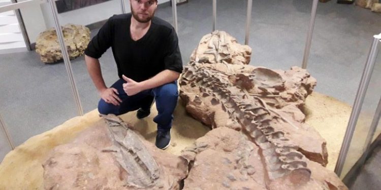 Scientist Rick Tolchard studying rauisuchians in the Geological Survey in Namibia. Credit: Helke Mocke