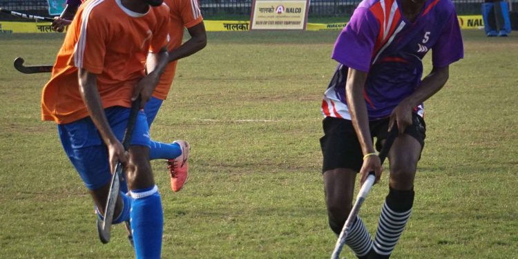 Players vie for the ball during the Sports Hostel versus Ganjam game