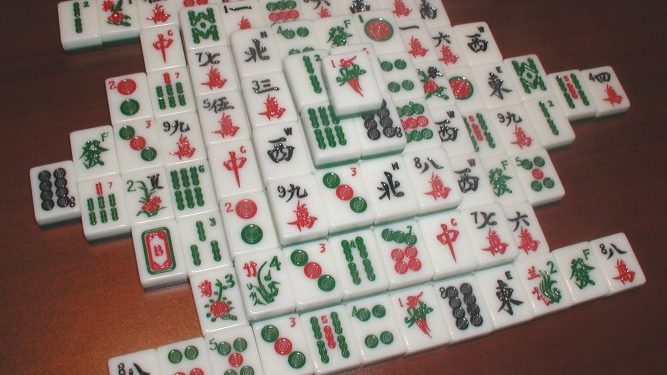 Mahjong is a tile-based game that was developed in China during the Qing dynasty and has spread throughout the world since the early 20th century.