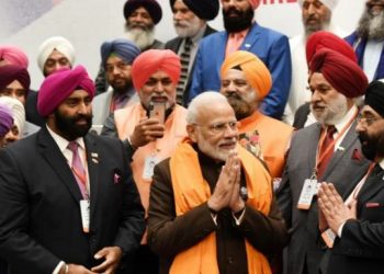 The community members met Modi Saturday in Houston and presented him with a traditional Siropa (long scarf).