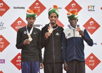 New Delhi: Gold medal winner Ethiopia's Andamlak Belihu, flanked by silver medallist compatriot Solomon Berihu (L) and bronze medallist Kenneth Kibiwott Kandie (R) of Kenya