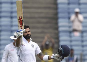 Virat Kohli acknowledges the applause after reaching his century against South Africa
