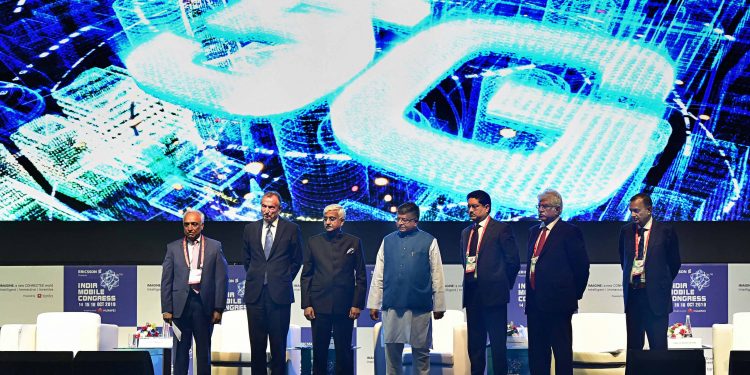 Top dignitaries at the Indian Mobile Congress pose with Telecom Minister Ravi Shankar Prasad
