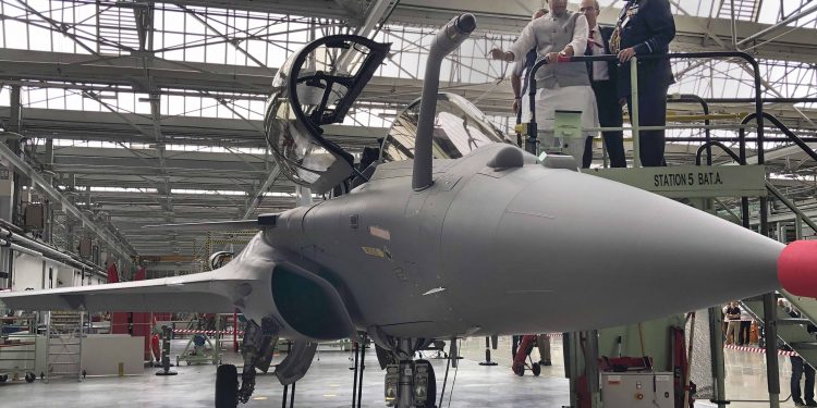 Rajnath Singh inspects a Rafale fighter aircraft at the Dassault Aviation factory in France